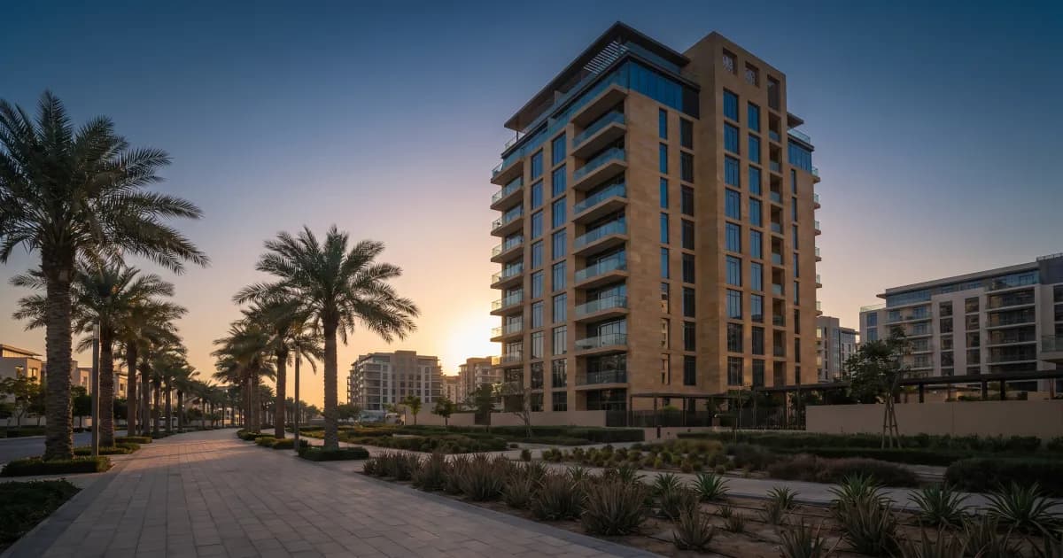 Modern Dubai residential apartment building exterior at golden hour, representing the RERA rental index and Dubai tenancy law.