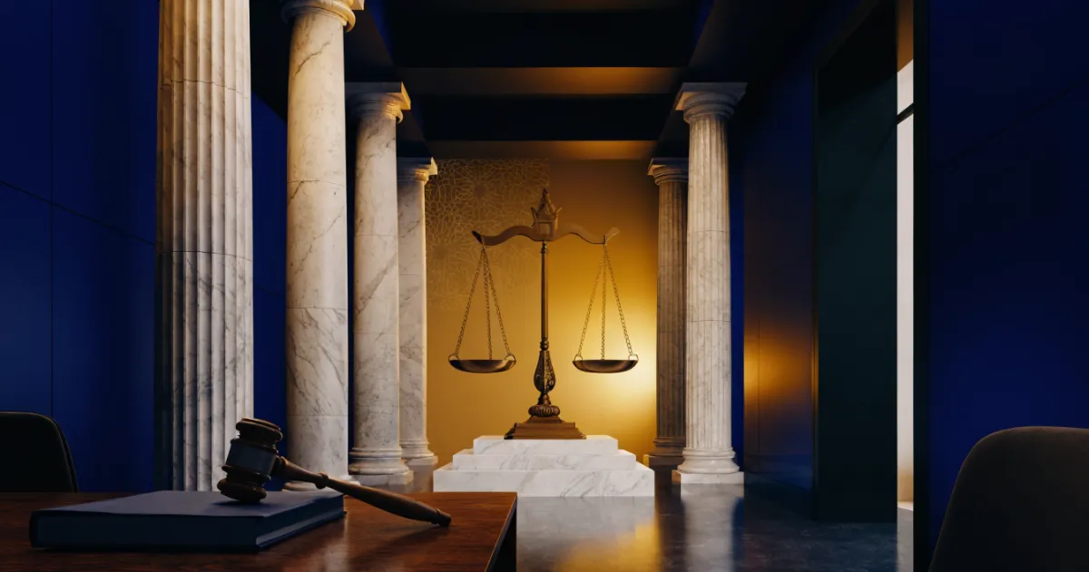 Scales of justice and case file inside a courthouse representing the UAE Public Prosecution
